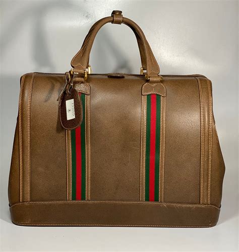 borse gucci a mano con targhetta|Borse Gucci in Pelle Marrone .